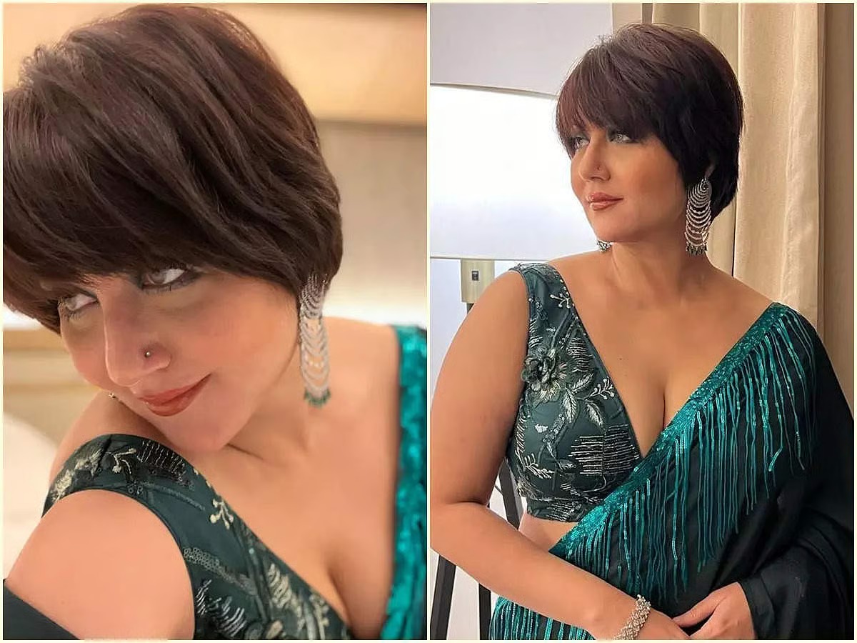 স্বস্তিকা মানেই নজরকাড়া সাজগোজ আর গতে বাধা সাজের বাইরে কিছু। এক্ষেত্রেও ব্যতিক্রম হয়নি। ছোট চুলের সঙ্গে মানানসই গয়না ও ব্লাউজের কাট বেছে নিয়েছেন অভিনেত্রী। এখানেও পরেছেন ডিপ ভি নেক।